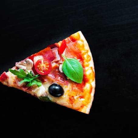 Flying Italian Pizza with Pepperoni, Cheese, and Basil Leaves Delicious Slices Isolated on White