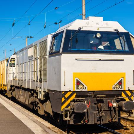 Freight Train Passing Goods Delivery at Station