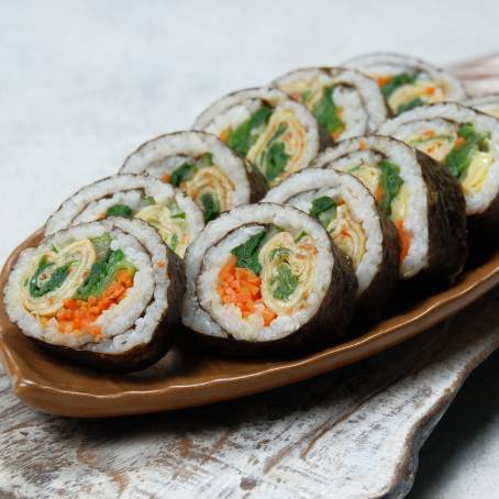 Fresh Gimbap Top View of Korean Rolls on White Background, Ready to Enjoy