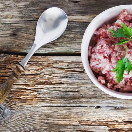 Fresh Minced Meat with Parsley on White Plate