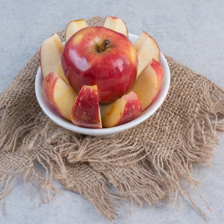 Fresh Red Apples and Slices Top View of Juicy Fruit for Healthy Eating on White Background