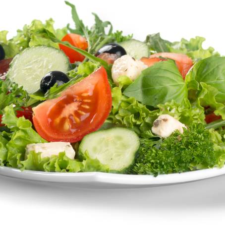 Fresh Spinach, Cherry Tomatoes, Lettuce, and Cucumber Salad in Bowl Isolated on White Background