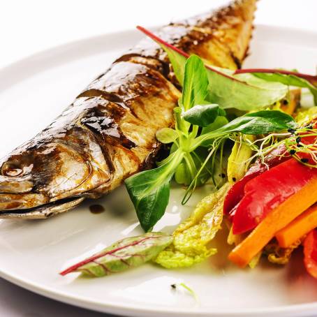 Fresh Spotted Mackerel Fish on White Plate TopDown View Ready for Cooking