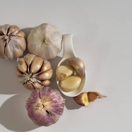 Garlic Head and Cloves Pile Isolated on White