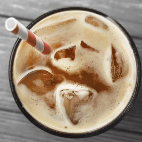 Glass of Iced Coffee with Ice Cubes Isolated on White Background from Above