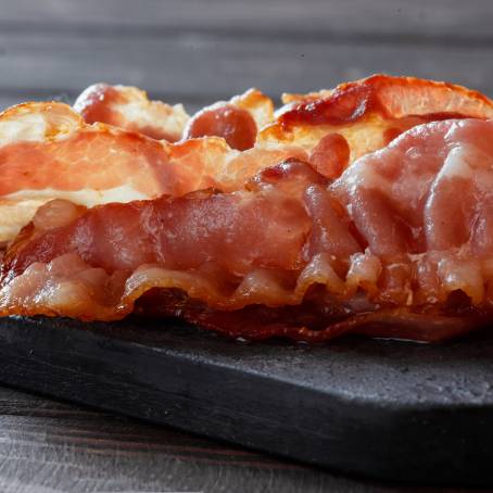 Golden Crispy Bacon Slice Isolated on Clean  Background