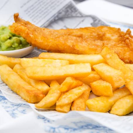 Gourmet Fish and Chips on a White Plate Top View