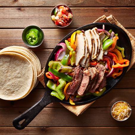 Grilled Chicken and Assorted Vegetables on Rustic Wooden Table