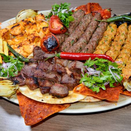 Grilled Meat Shish Kebab with Fresh Green Salad on White Plate Perfect Meal for Any Occasion