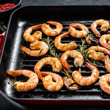 Grilled Prawns on Black Plate from Above Ideal for Culinary Showcases and Food Menus