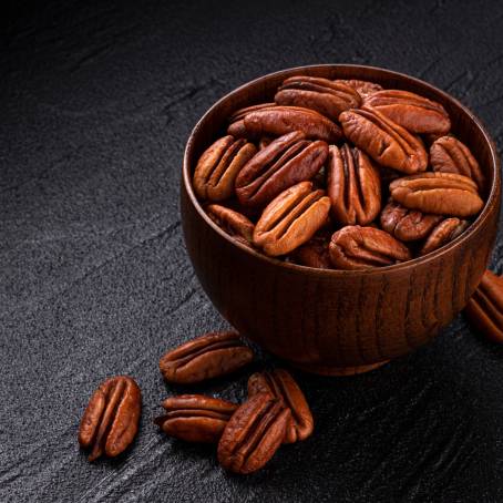 Group of Peeled Pecans on White