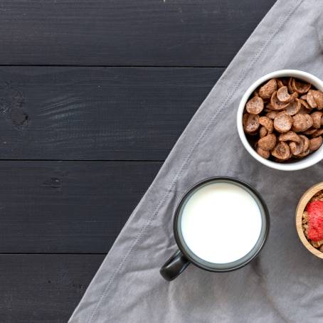 Homemade Granola with Milk and Fresh Fruit for Breakfast