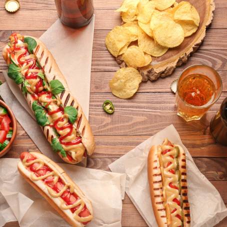 Hot Dog with Mustard and Ketchup, Paired with Beer on a Table