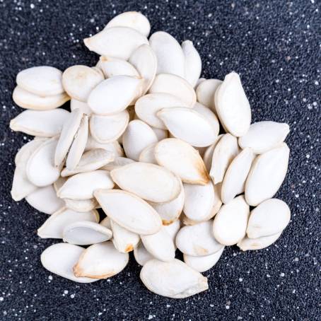 Hulled Pumpkin Seeds CloseUp of ShellFree Seeds on White