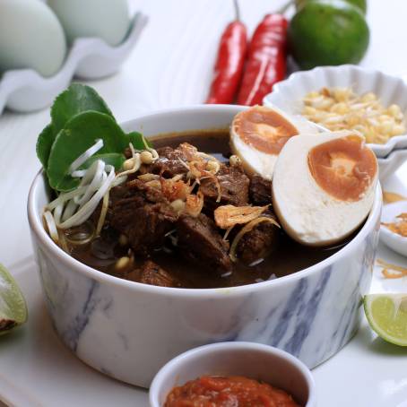 Indonesian Rawon Black Beef Soup with Rice and Side Dishes