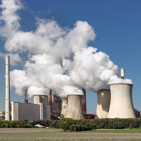 Industrial Twilight Smoke and Lignite Mine Chimneys