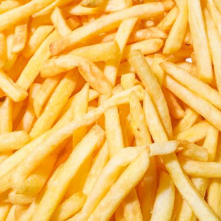 Isolated French Fries Floating in Air Potato Chips Flying, White Background, Fast Food Treats