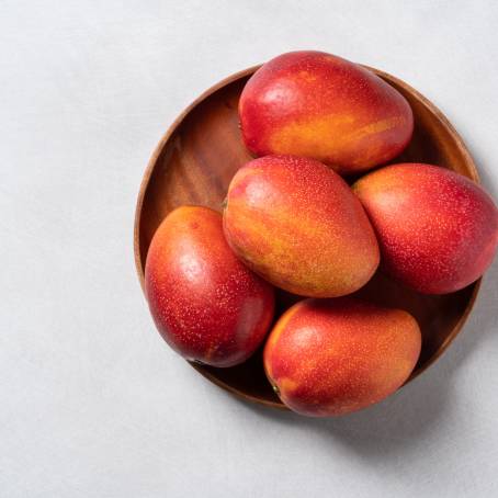 Isolated Fresh Yellow Mango from Above on a Plain Background, Ideal for Tropical Food Photos