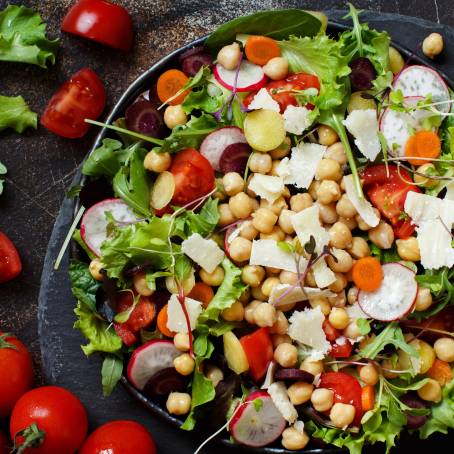 Isolated Greek Salad with Cheese and Veggies on White Background