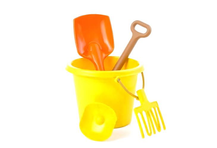 Isolated Kids Toy Bucket with Shovel and Rake Perfect for Summer Outdoor Activities