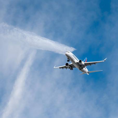 Jet Stream and Airplane Contrail in Blue Sky Formation of Ice Crystals from Jet Exhaust