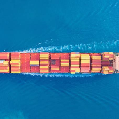 Large Container Ship in Ocean with Aerial Perspective