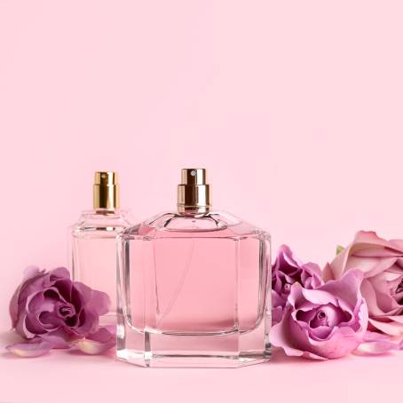 Luxurious Perfume Bottles with Roses on Pink