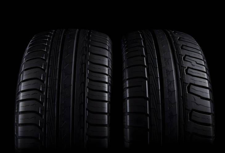 New Tires on Dark Isolated Background Close Up of Durable and High Performance