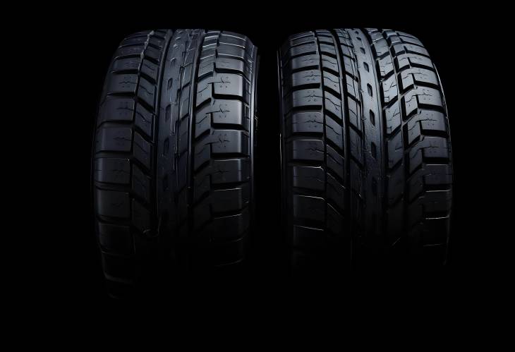 New Vehicle Tires on Dark Isolated Background CloseUp of Quality and Design