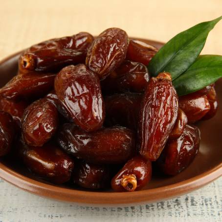 Nutritious Dried Dates on a White Surface