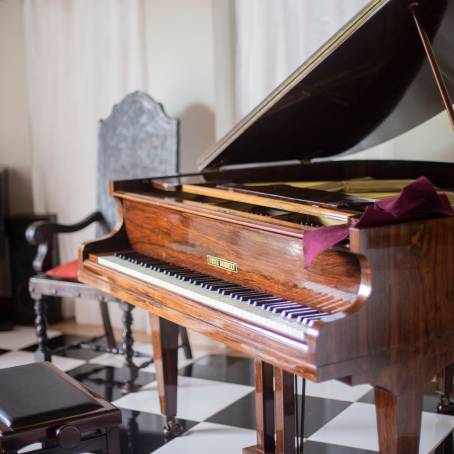 Old Grand Piano with Classic Wood Finish and Elegant Details