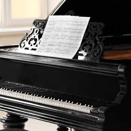 Old Grand Piano with Detailed Woodwork and Elegant Finish