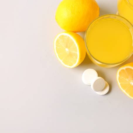 Orange Vitamin C Bubbles and Dissolution in Water  Close Up View