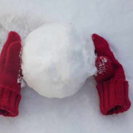 Pair of Cozy Red Knitted Mittens with Christmas Design Isolated on White Background