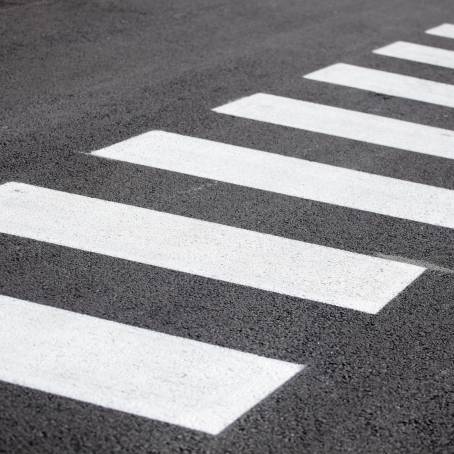 Pedestrian Crosswalk Safety Signs on Empty Street