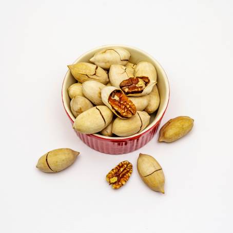 Peeled Pecans Cluster on White Background