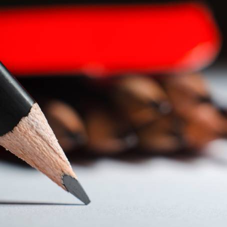 Red Background CloseUp of Broken Pencil Tip Graphite and Wood Details