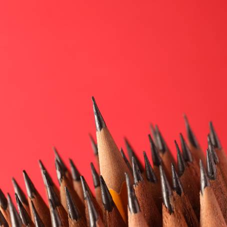 Red Background Detailed CloseUp of Broken Pencil Tip with Graphite