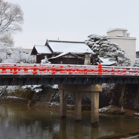 Red Historic Nakabashi Bridge in Takayama with Scenic River