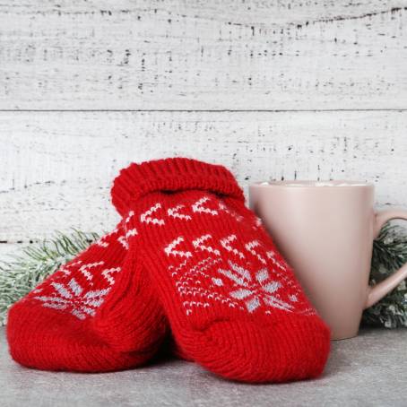 Red Knitted Mittens with Christmas Design Isolated Pair on White Background for Festive Season