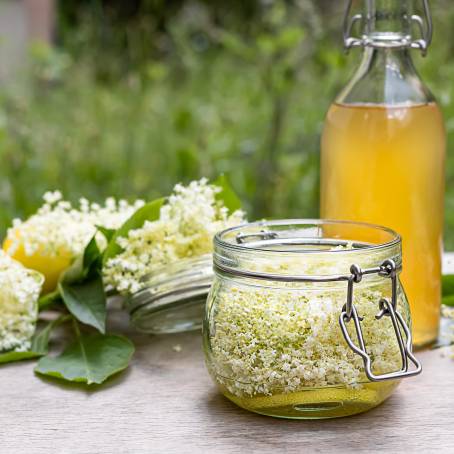 Refreshing Peach Lemonade in Bottles at Outdoor Party