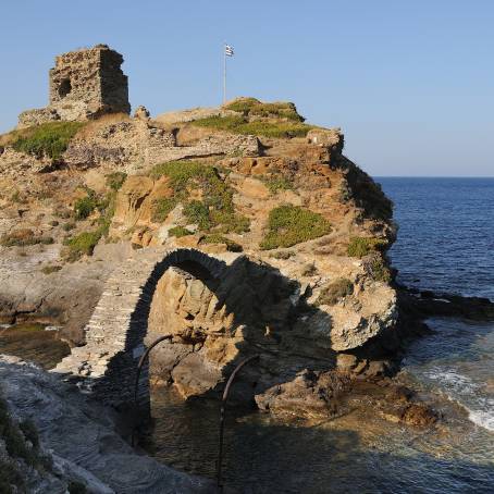 Scenic Summer Sunrise at Andros Castle with Historic Stone Bridge, Greece