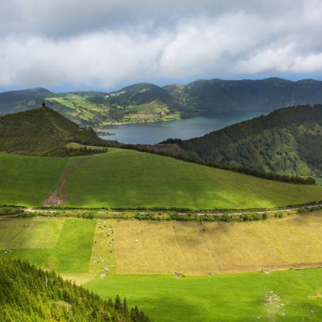 Scenic Sunset Over Verdant Volcano Crater and Tranquil Lake in Azores, Portugal