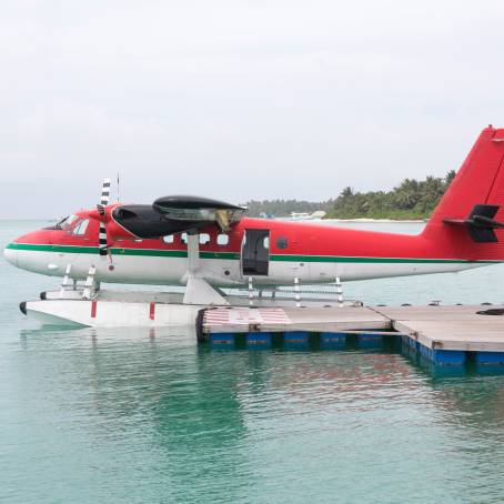 Seaplane Approaching Maldives Island TopDown View