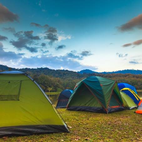 Serene Lakeside Camping Tent with Reflection on Calm Water