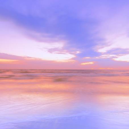 Serene Seascape with Gentle Waves and Cloudy Skies