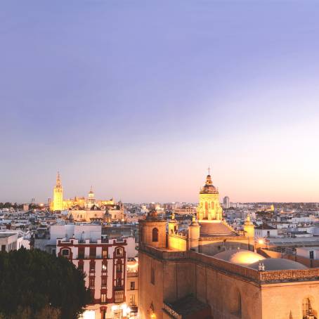 Seville Iconic Metropol Parasol Illuminated at Dusk with City Skyline