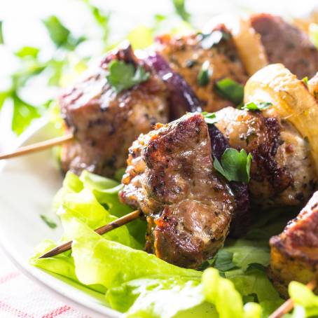 Shish Kebab with Green Salad on White Plate A Flavorful and Nutritious Meal Option