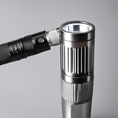 Silver and Black LED Flashlight Detailed Close Up of Torch Head with Black Plastic on White 