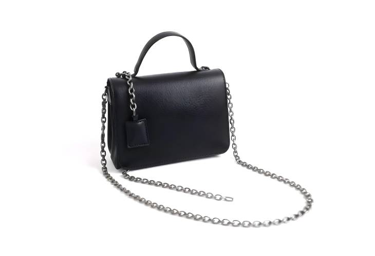 Sophisticated Black Leather Handbag with Chain Detail for Women, Isolated on White